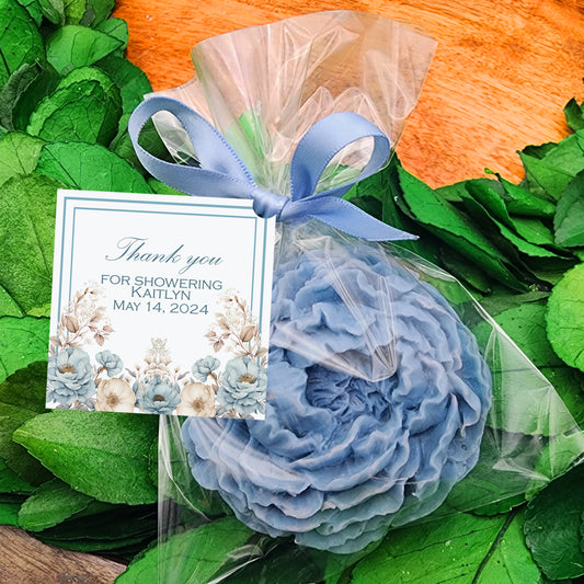a bouquet of flowers and a thank you card on a table