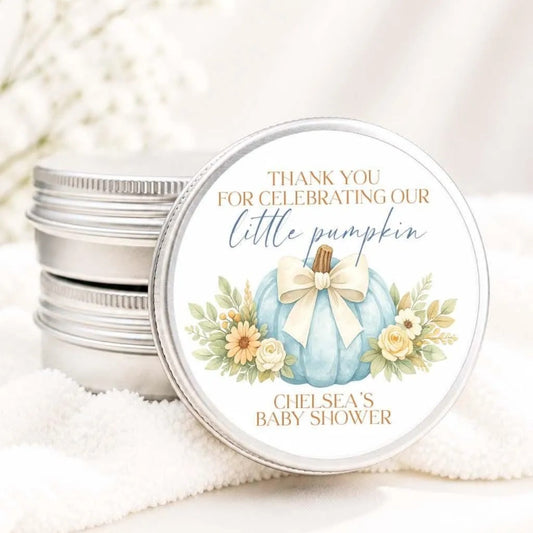 A round tin can with a label that says "Thank you for celebrating our little pumpkin" and " Chelsea's Baby shower"