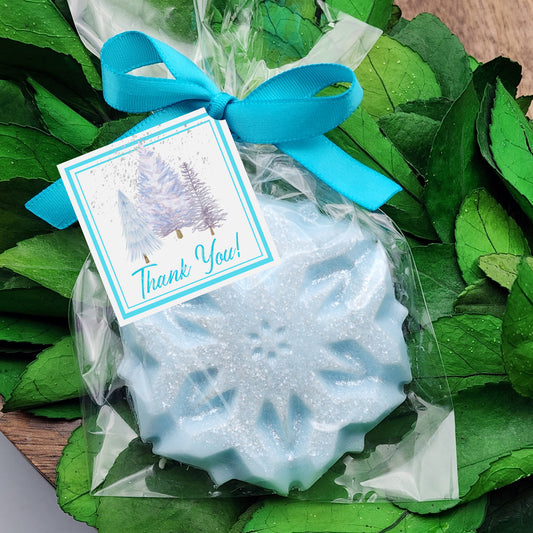 a thank you soap with a blue ribbon on it
