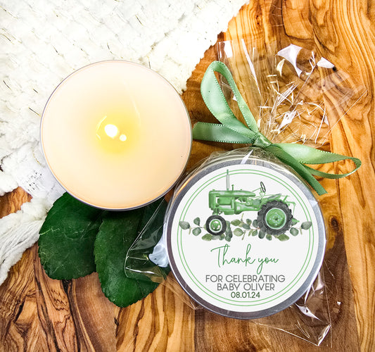 a candle sitting next to a jar of wax on a wooden table