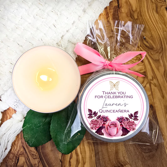 a candle and some flowers on a table