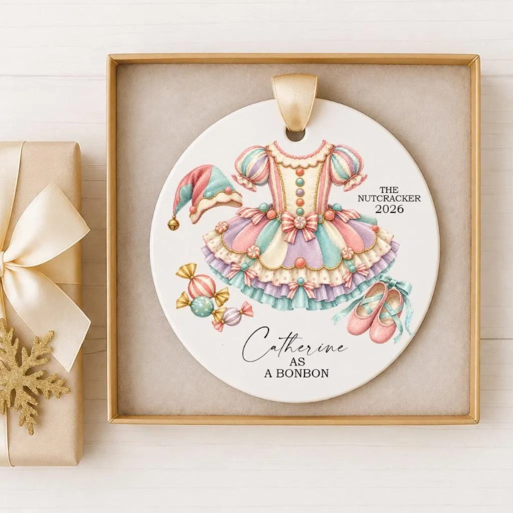 A decorative ornament featuring a colorful ballerina dress and ballet slippers, with the text "The Nutcracker 2016 Catherine as a Bonbon" displayed on it.