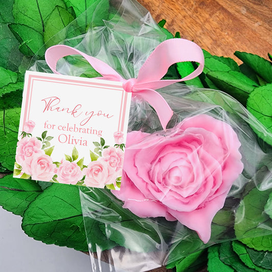 a bouquet of pink roses with a thank you card