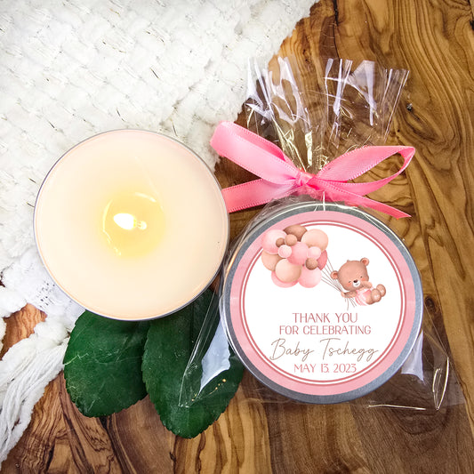 a candle and a package of candy sitting on a table