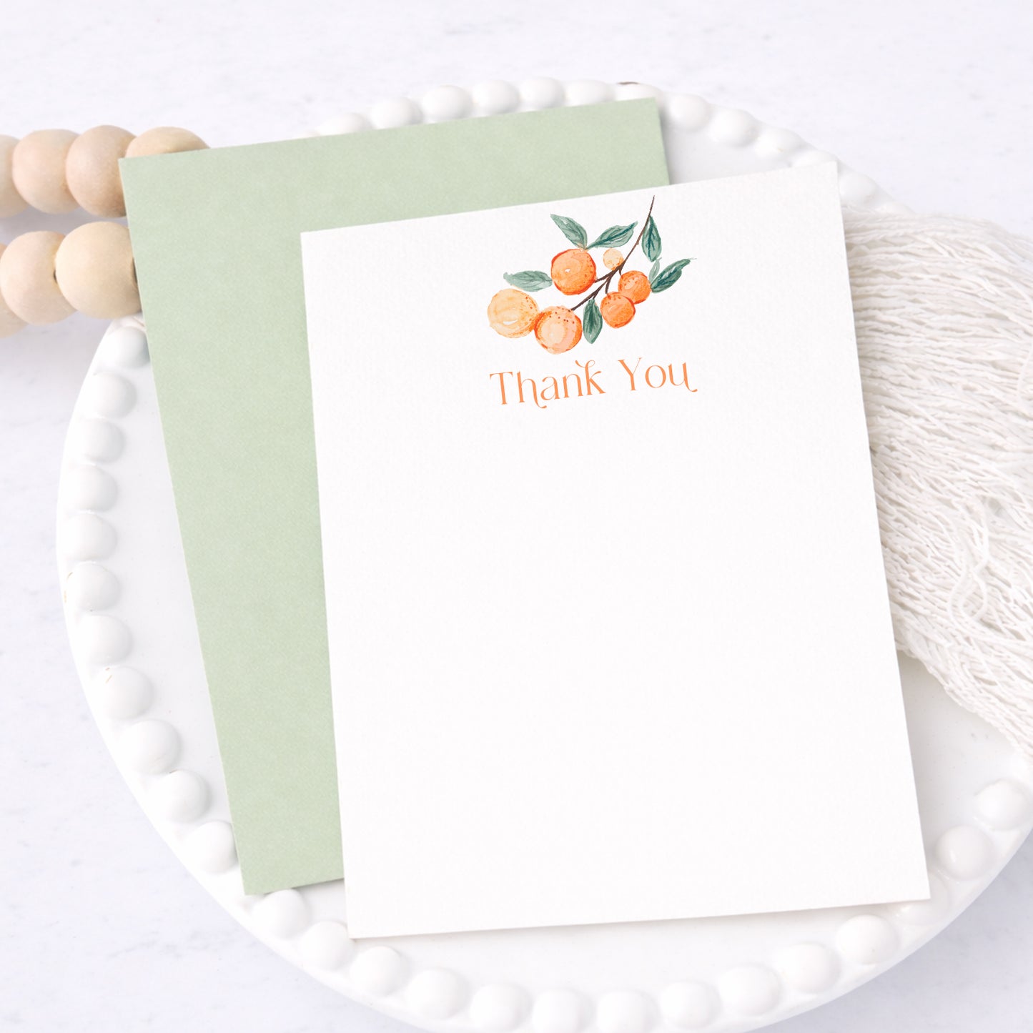 A Little Cutie thank you cards with citrus design displayed as baby shower stationery set with envelopes.