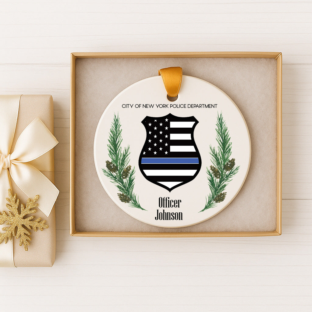 A decorative ornament featuring a police officer's badge and the text "City of New York Police Department" and "Officer Johnson" on a white background.