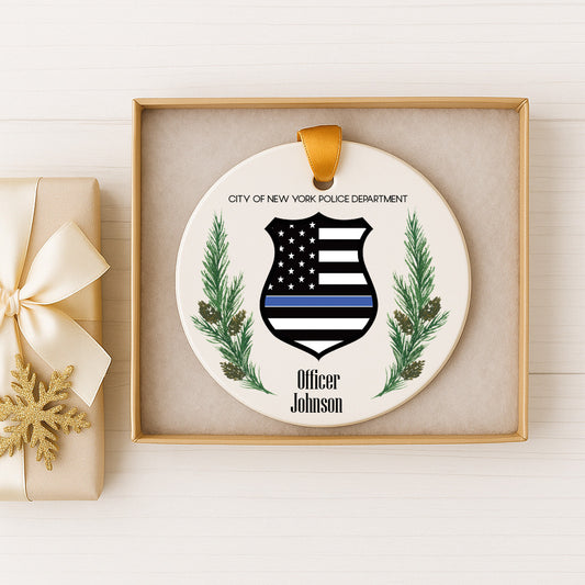 A decorative ornament featuring a police officer's badge and the text "City of New York Police Department" and "Officer Johnson" on a white background.
