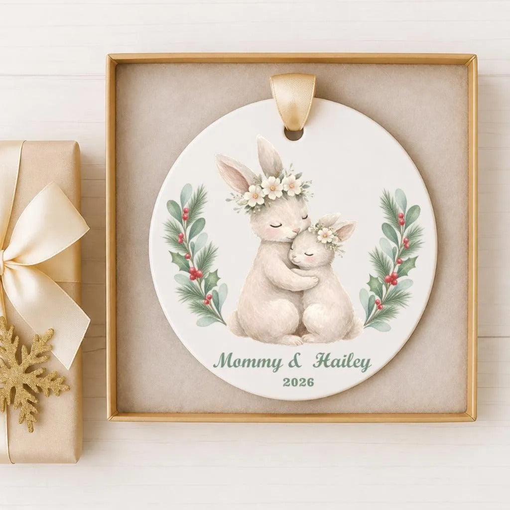 A decorative ornament featuring a mother rabbit and her baby bunny, with the text "Mommy & Hailey" and the year "2026" below the image.