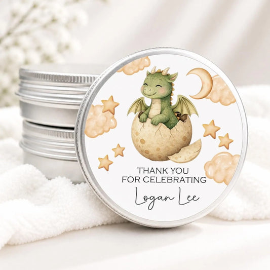 A round tin lid with a dragon illustration and stars on it, placed on a white cloth.