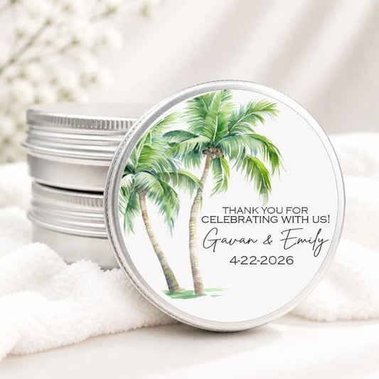 A round tin lid with a tropical palm tree design and text that says "Thank you for celebrating with us! Gavin & Emily 4222-2026".