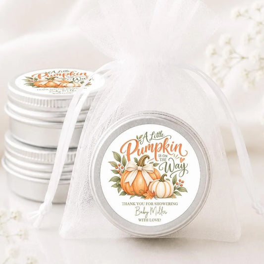a set of silver tin jars with white labels, each containing a decorative label with a pumpkin and text.