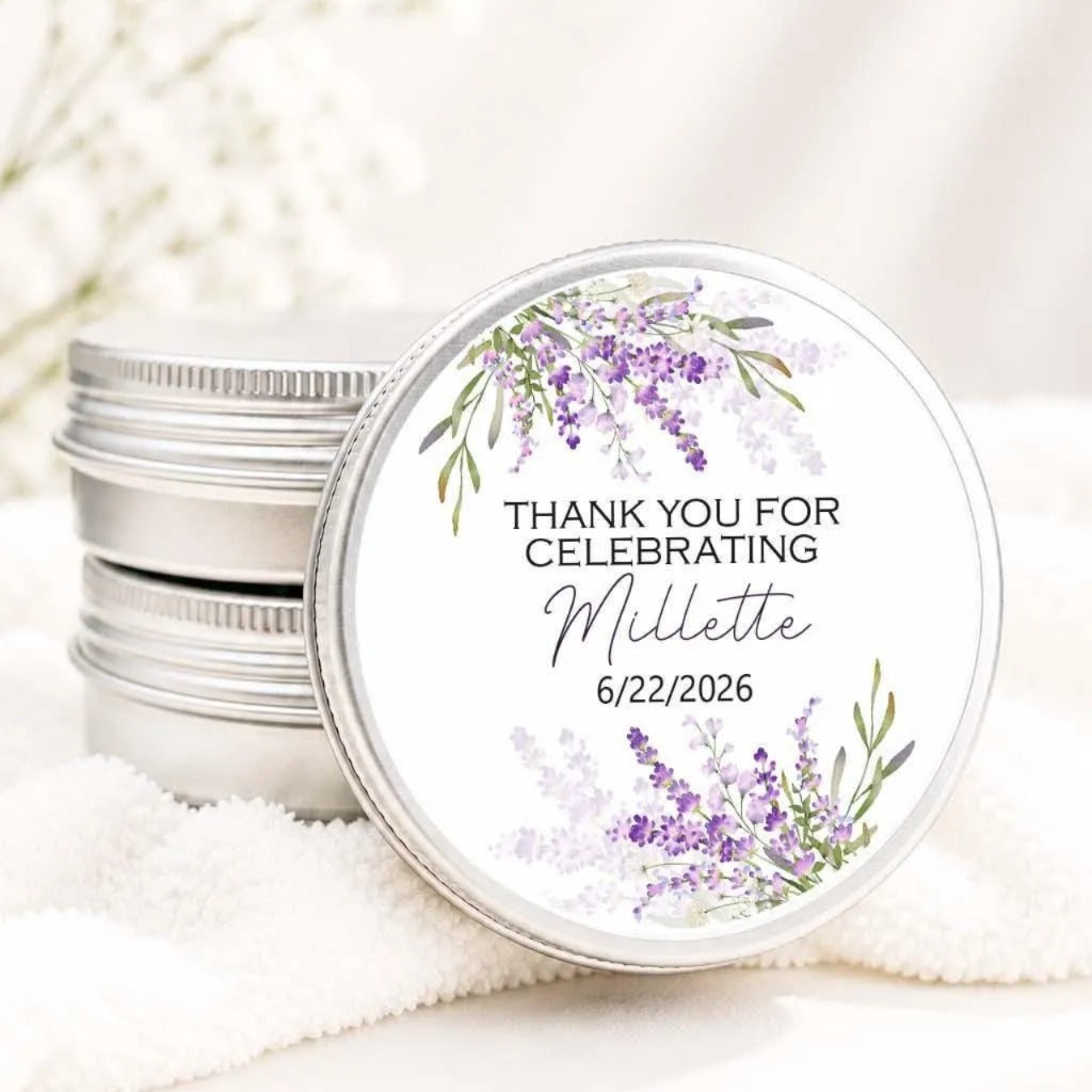 a round tin lid with a floral design and text on it, placed on a white cloth.