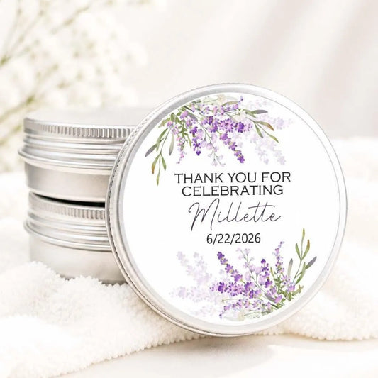 a round tin lid with a floral design and text on it, placed on a white cloth.