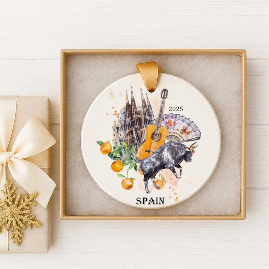 A decorative ornament featuring a bull, a guitar, and a castle, along with the text "SPAIN" and the year "2025".