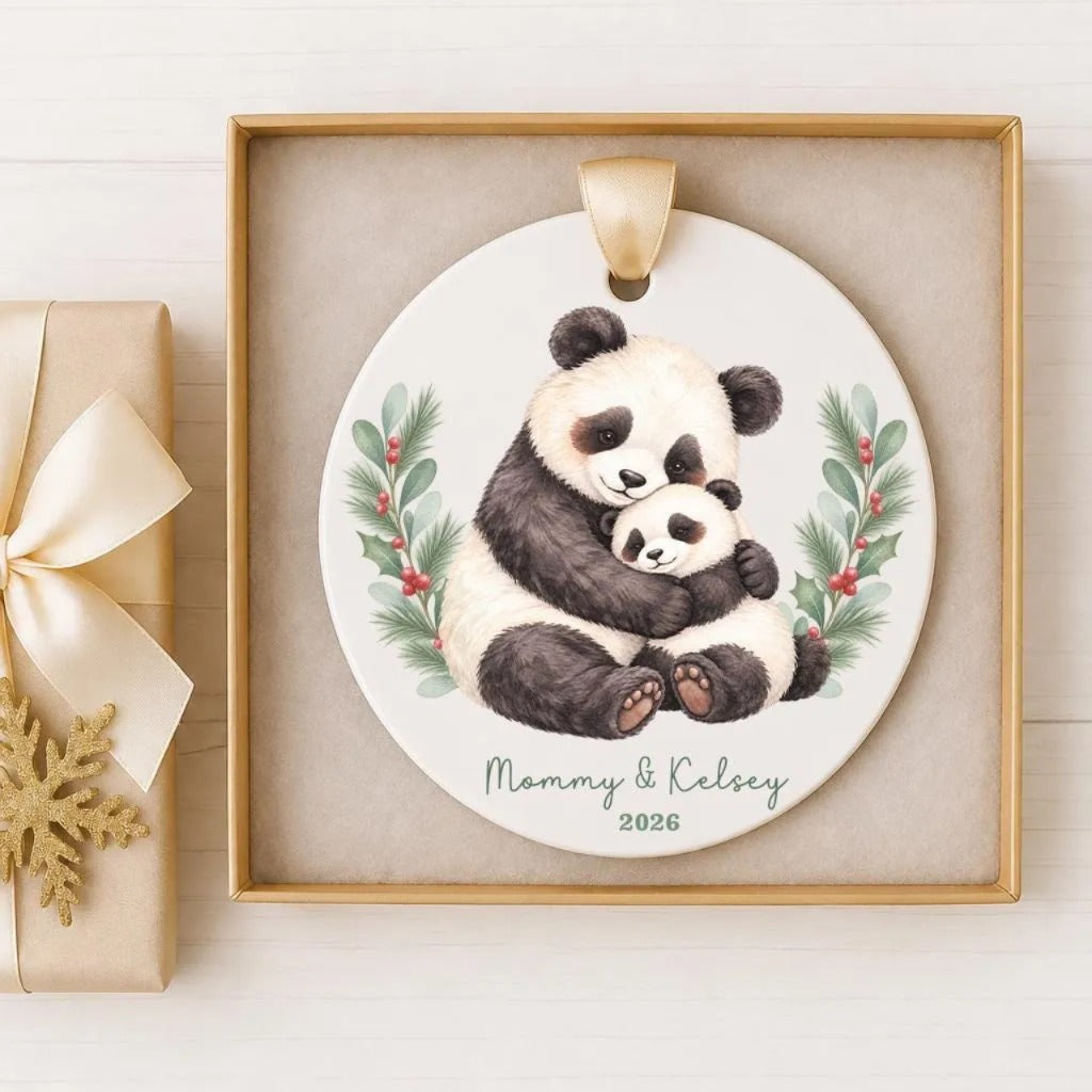 A ceramic ornament featuring a mother panda embracing her cub, with the text "Mommy & Kelsey" and the year "2026" below the image.