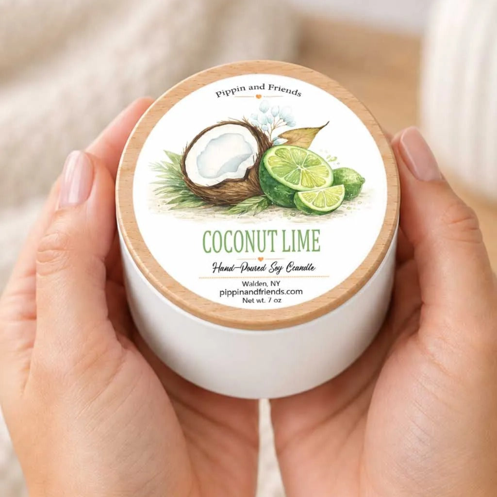 A person's hands holding a white container with a label that features an illustration of a coconut and lime slices.