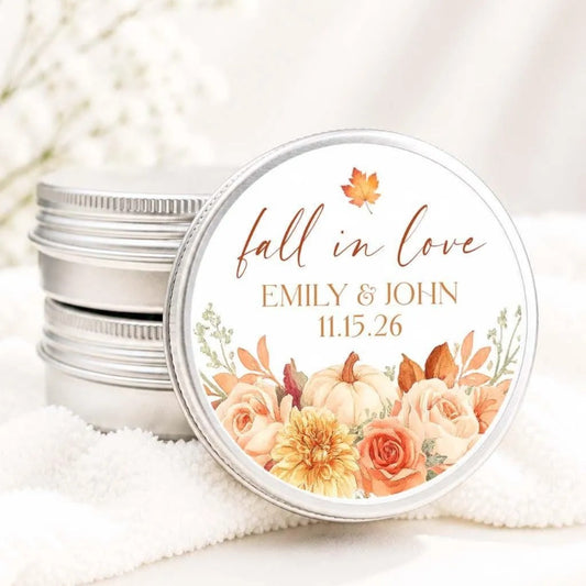 A round tin lid with a floral design and text, placed on a white cloth.