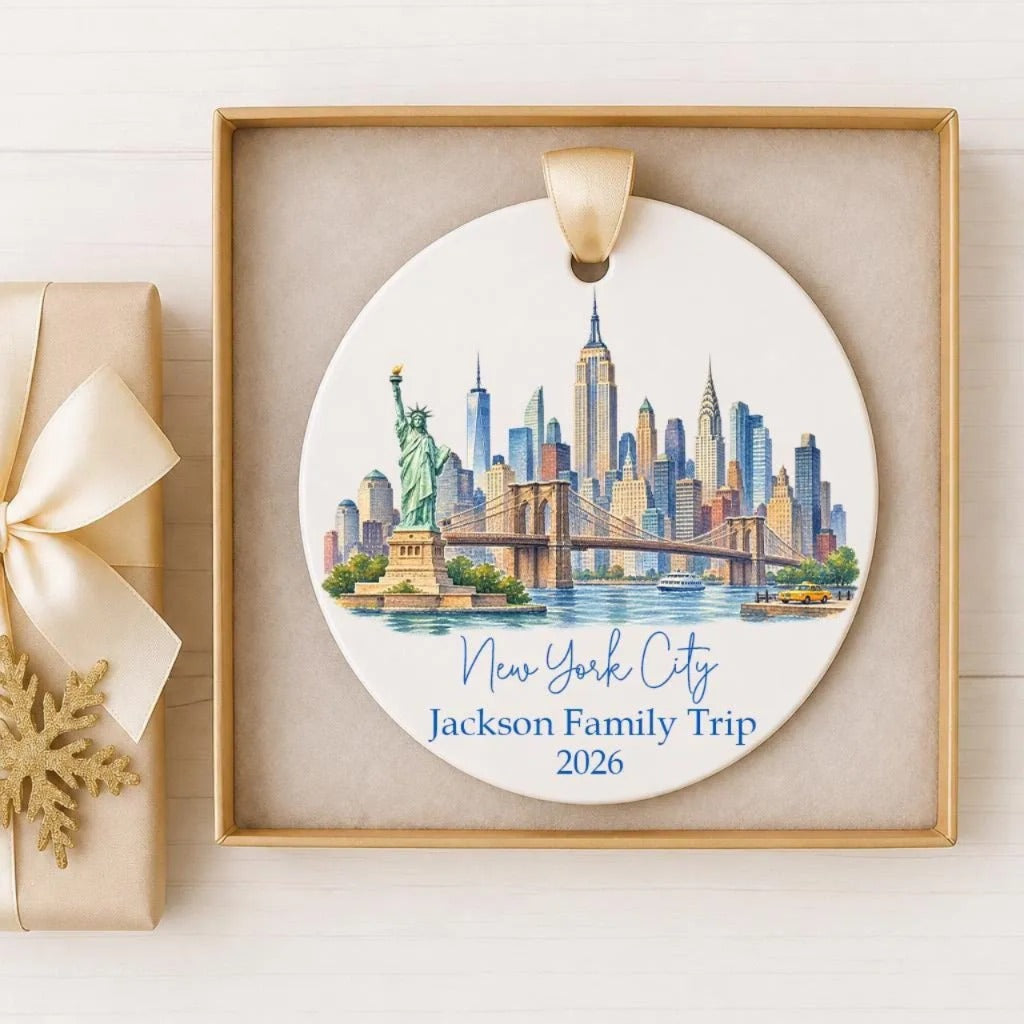 A decorative ornament featuring the Statue of Liberty and the New York City skyline, with the text "New York City Jackson Family Trip 2026" printed on it.