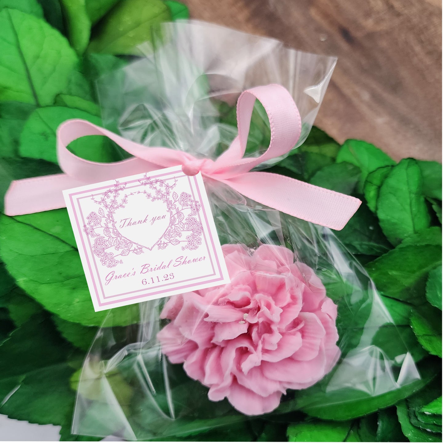 a bouquet of pink flowers wrapped in cellophane