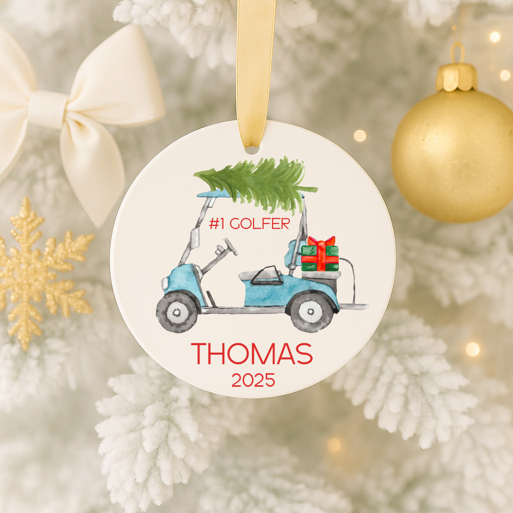 A Christmas ornament featuring a golf cart with a Christmas tree on top, hanging on a tree.