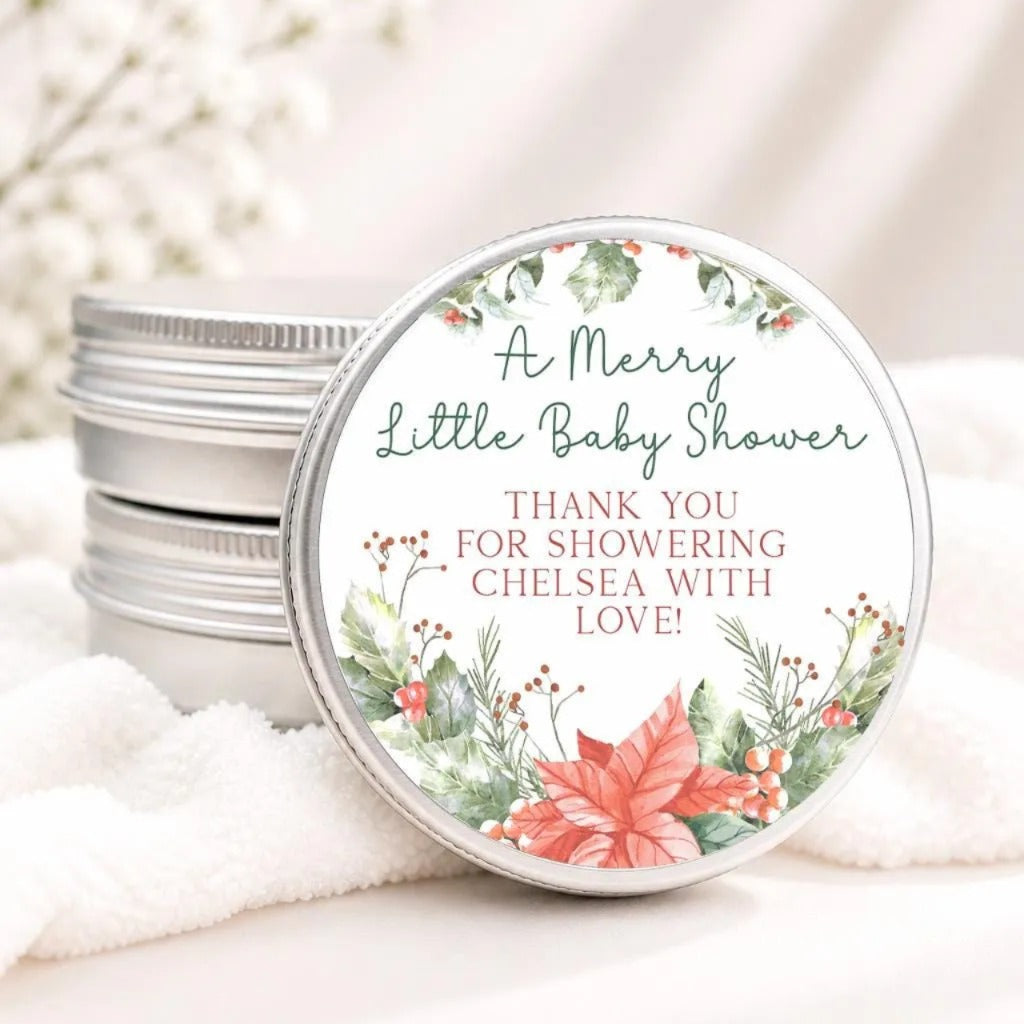 A round tin lid with a floral design and text, placed on a white cloth.