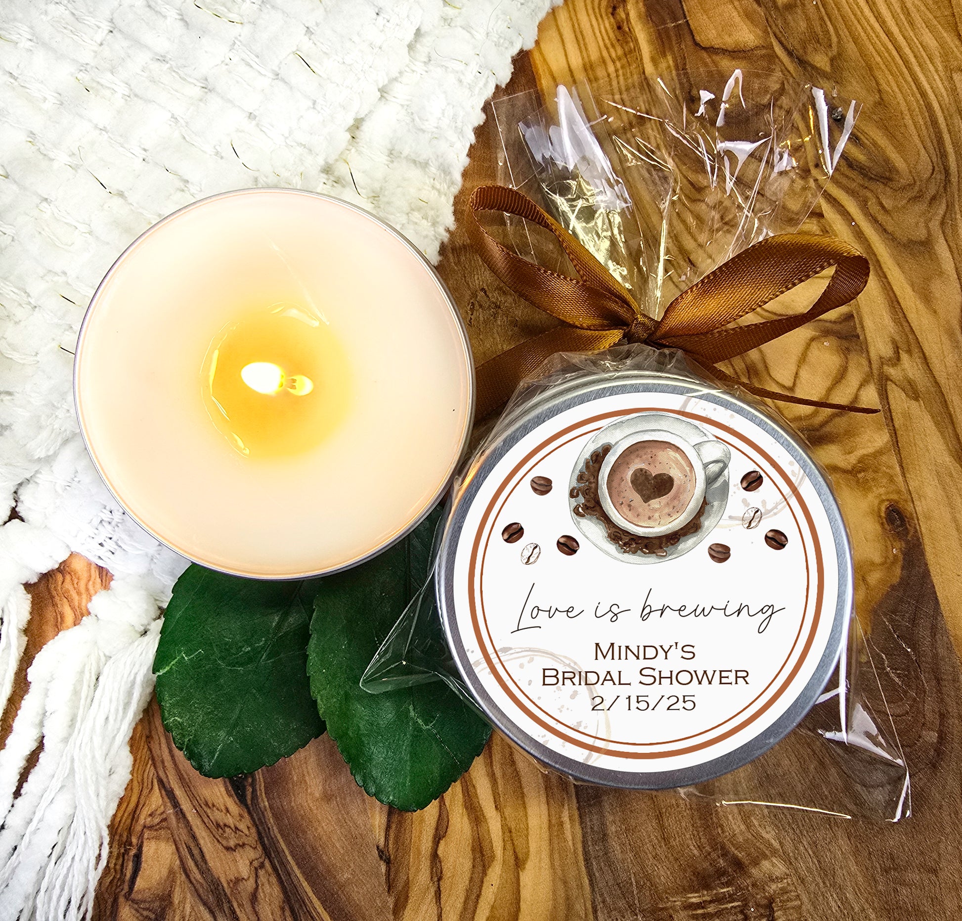 a white candle sitting on top of a wooden table