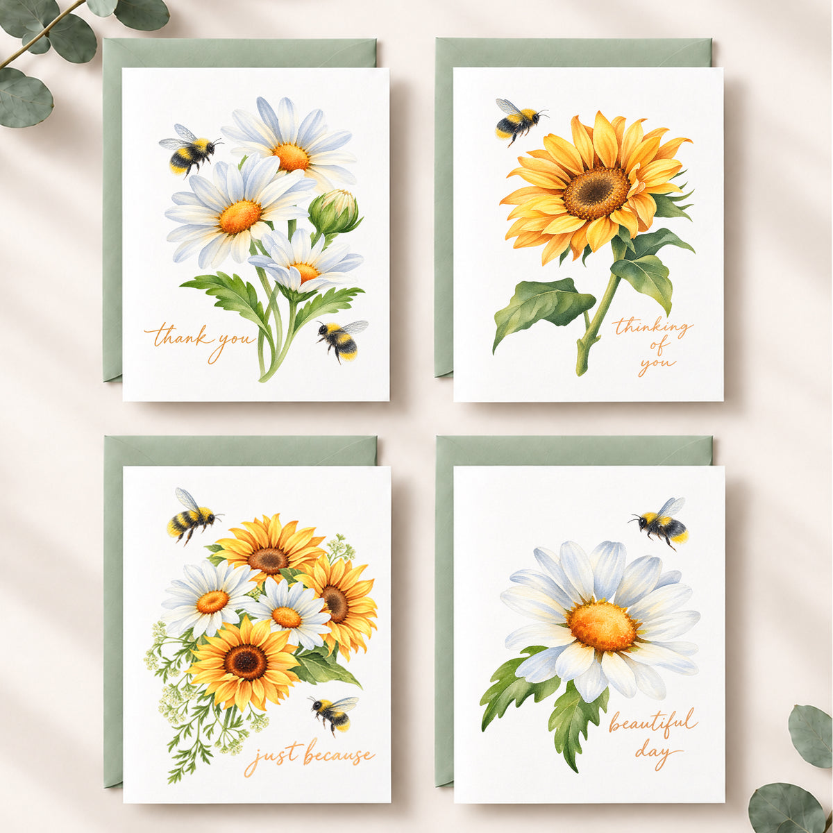 Set of four watercolor floral notecards featuring sunflowers, daisies, and bumblebees with thank you, thinking of you, just because, and beautiful day sentiments, paired with sage green envelopes