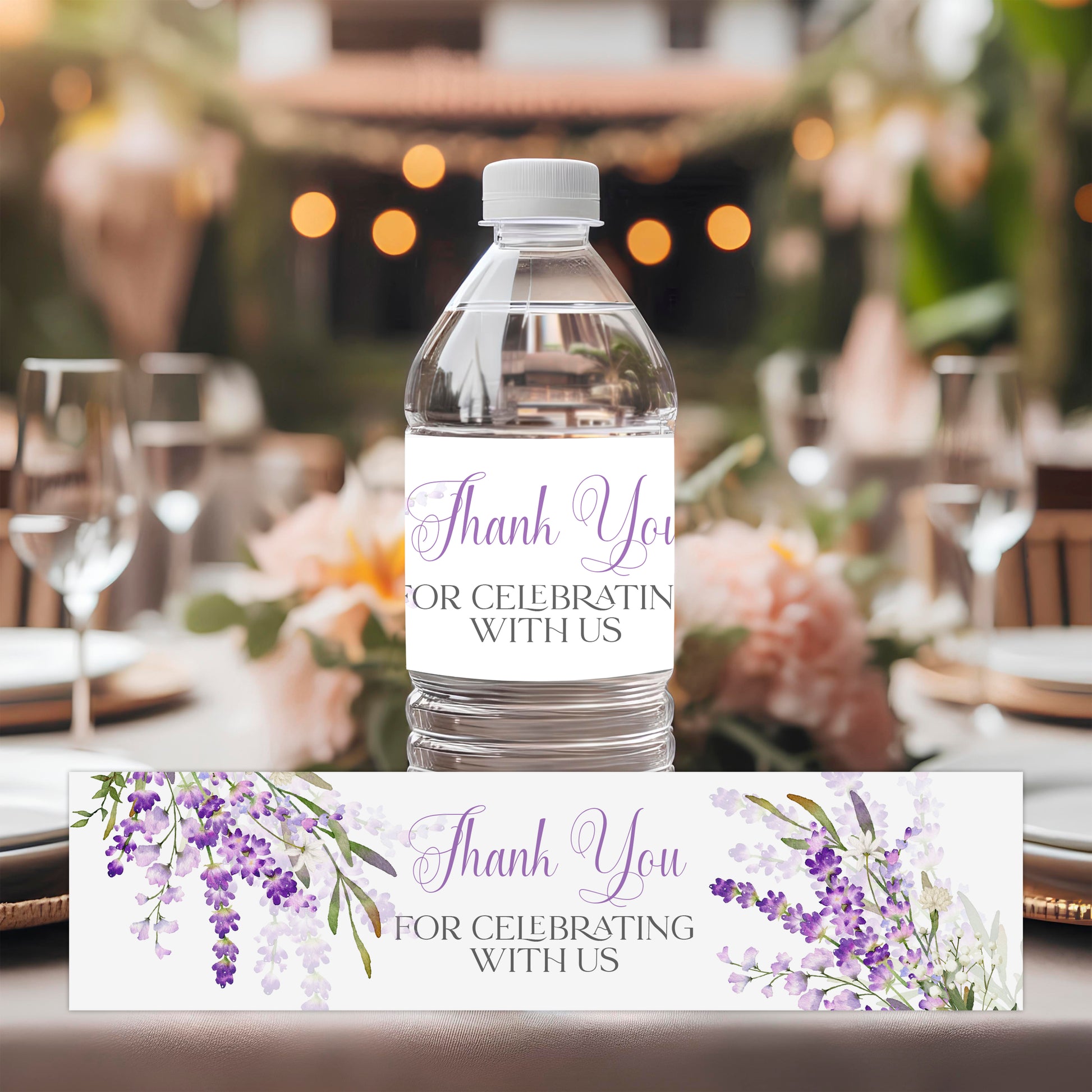 Lavender water bottle labels with purple floral design applied to bottles for bridal shower or wedding drink station decor.