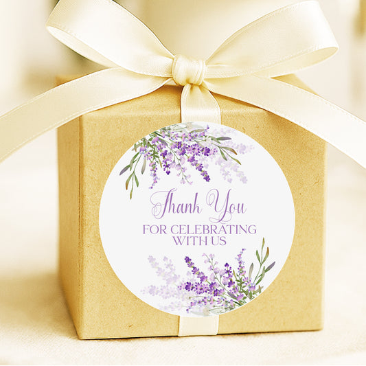 Lavender thank you stickers with purple floral design applied to favor bags for bridal shower or wedding party favors.