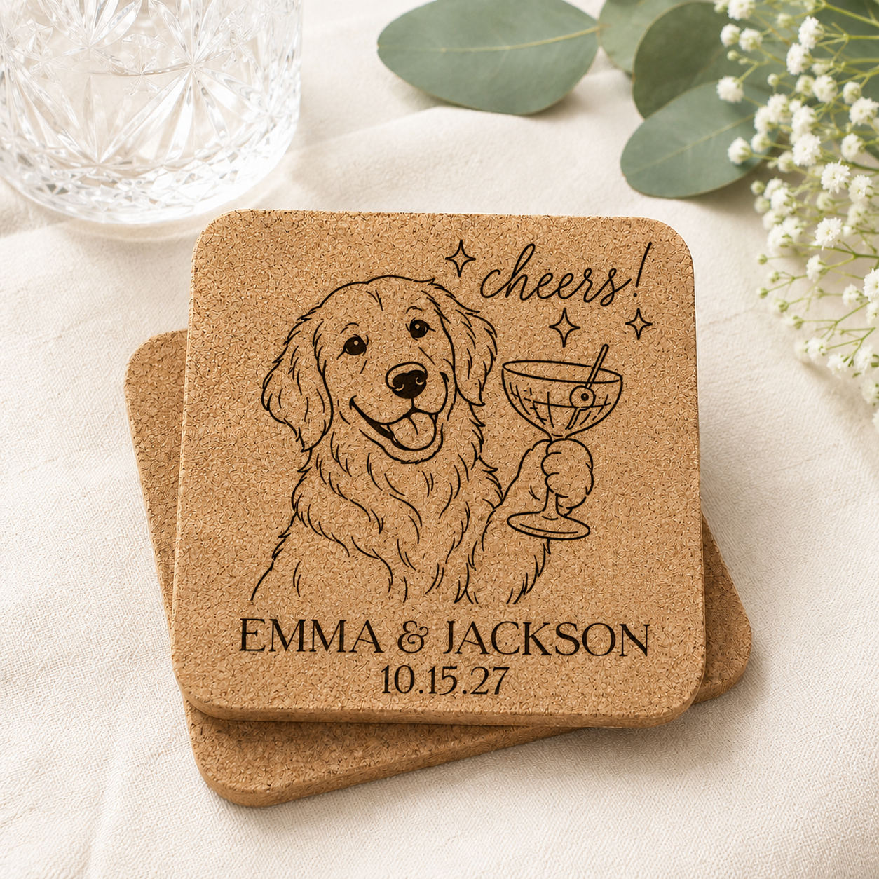 Personalized cork wedding coaster featuring a laser engraved Golden Retriever holding a cocktail with custom names and wedding date, displayed in a light and airy wedding-inspired setting.