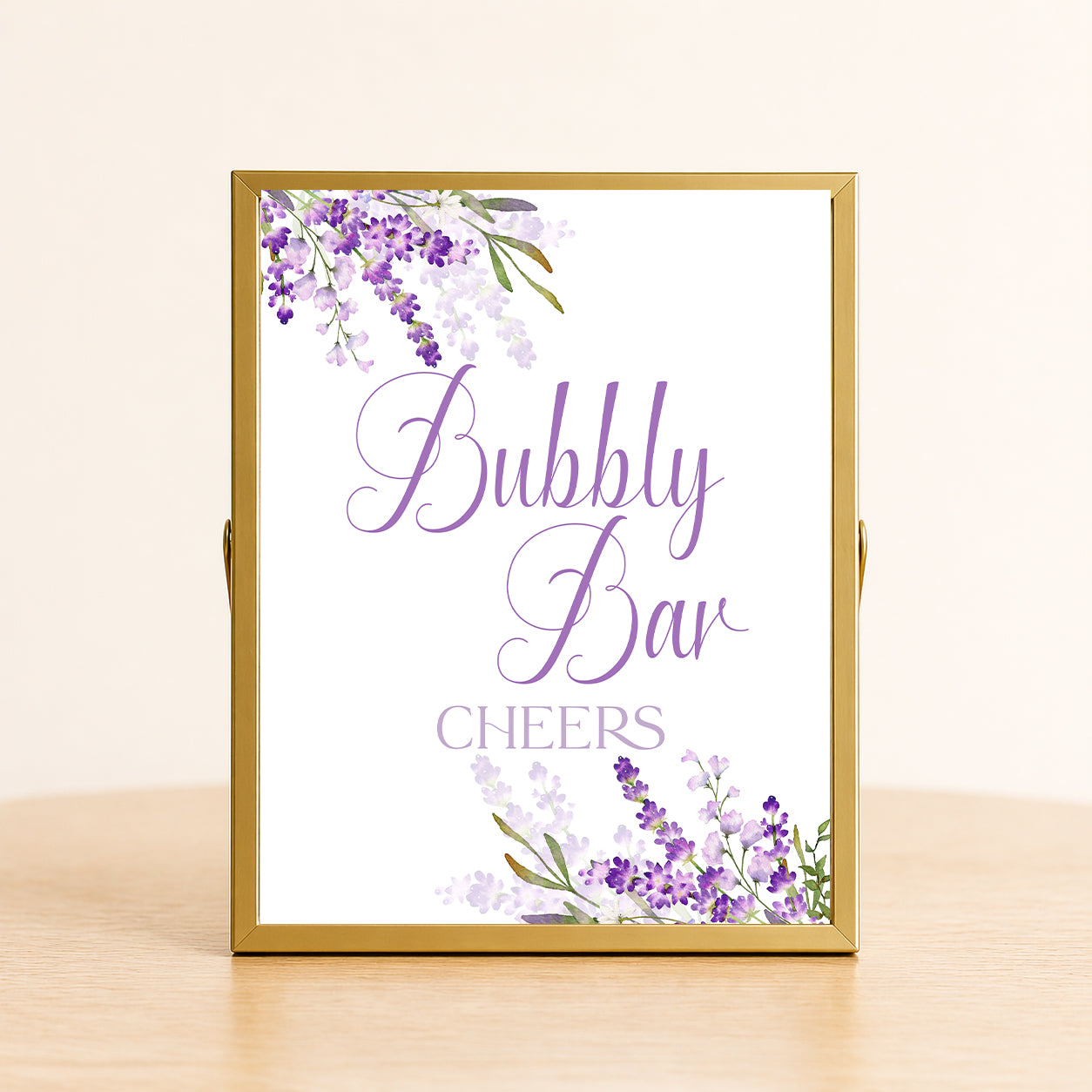 Lavender bubbly bar sign with purple floral design displayed on table for bridal shower or wedding champagne bar decor.
