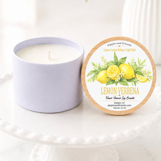 Lemon Verbena soy candle in a white ceramic vessel with a natural wood lid featuring a watercolor lemon label, hand-poured by Pippin and Friends