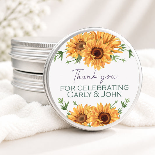 Personalized sunflower wedding candle favor in a silver tin featuring bright watercolor sunflowers, greenery, and custom wedding details, displayed on a soft white background.