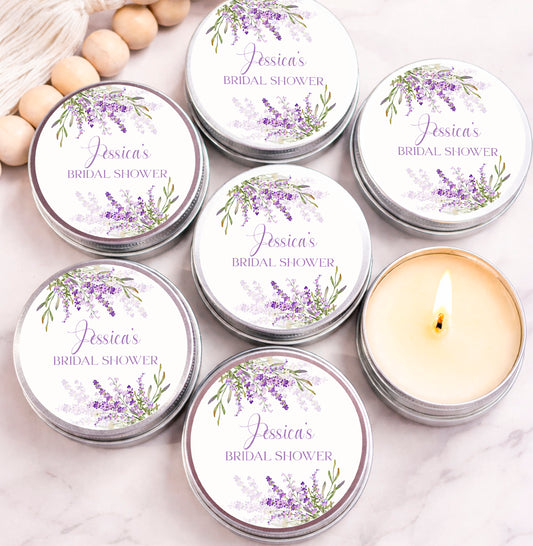 Personalized lavender candle favors with purple floral labels  arranged in silver tins for wedding or bridal shower favors.