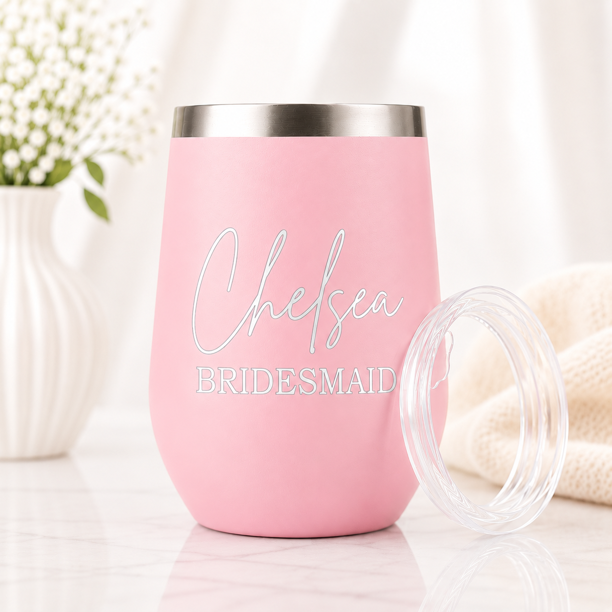 Personalized pink insulated wine tumbler with custom engraved name and bridal party title. Features a stainless steel rim, clear lid, and elegant laser-engraved design, perfect for bridesmaid gifts, bridal party proposals, and wedding day celebrations.