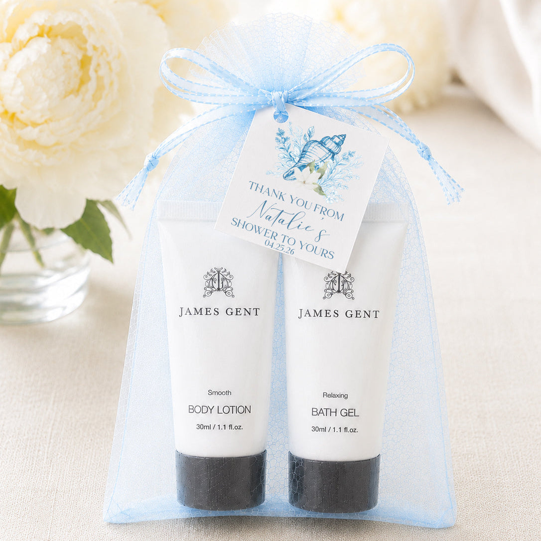 two tubes of James Gent body lotion and bath gel, each wrapped in a mesh organza bag and tied with a blue ribbon.