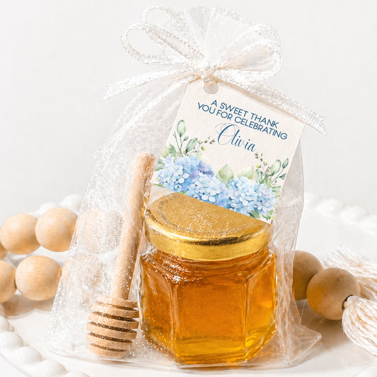 Hydrangea honey jar favor kit with mini glass jar, wooden dipper, sheer tulle bag and personalized blue floral tag for baby shower or wedding