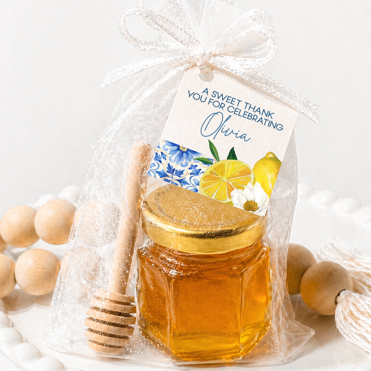 Lemon honey jar favor kit with mini glass jar, wooden dipper, sheer bag and personalized Amalfi citrus tag for bridal shower or wedding