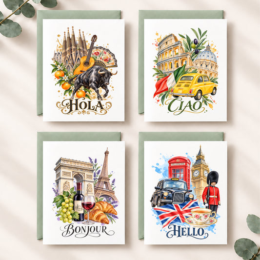 Four illustrated greeting cards arranged in a 2x2 grid on a light beige surface with eucalyptus leaves. The cards feature watercolor-style travel scenes: Barcelona with a guitar and bull, Rome with a yellow taxi, Paris with wine and croissants, and London with a red telephone booth and Union Jack.